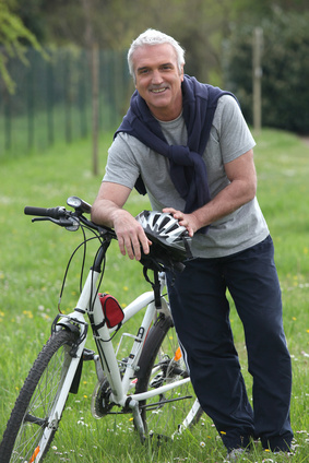 Cyclist stopped in a park